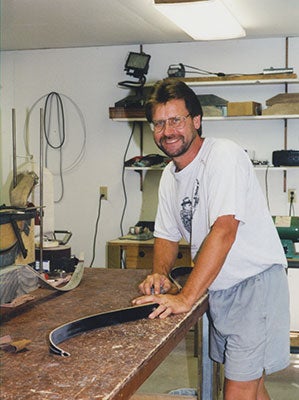 Old newspaper article featuring Dale Karch with his 500 pound Wisconsin black bear. Killed with a Tomahawk Bow.