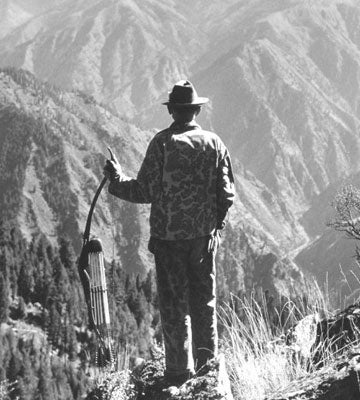 Old image of Fred Bear looking over a valley